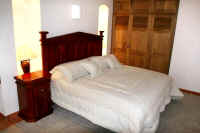 condo bedroom with queen bed