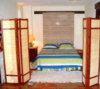 LP-25 studio condominium king bed area