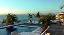 La Palapa rooftop pool terrace with view north of the city and Bay