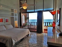 waterfront master bedroom with balcony and views of Los Muertos beach