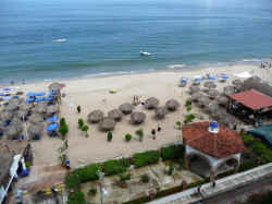 beach-front view, puerto vallarta blue chairs on the left  blue seas on right