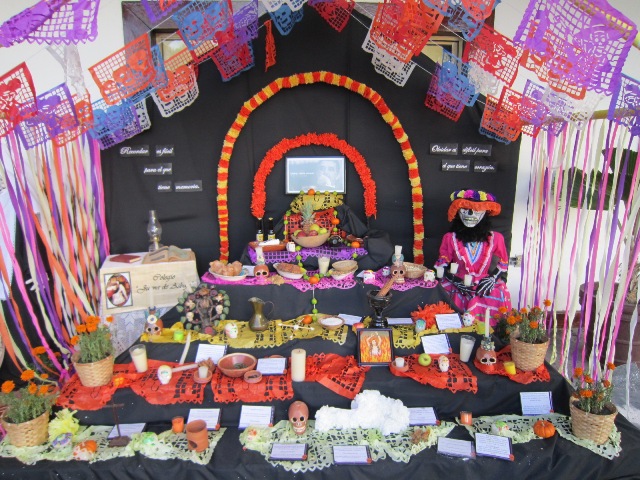 dia de los muertos celebrations Vallarta - note skulls, food, alcohol, marigolds and the katrina