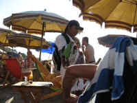 friendly beach vendor with souvenirs
