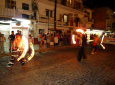 gay puerto vallarta street performers during Carnival - playing with fire